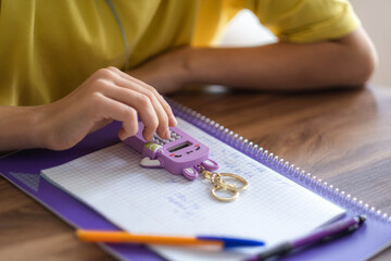 hands pupil close up, school girl going math homework at home, calculating