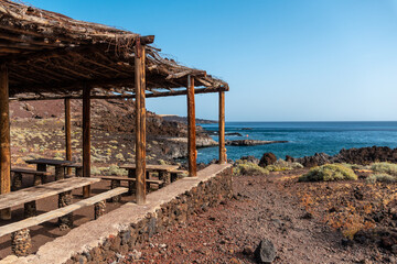 Fototapeta na wymiar Recreational area for barbecues on the beach of Tacoron in El Hierro, Canary Islands