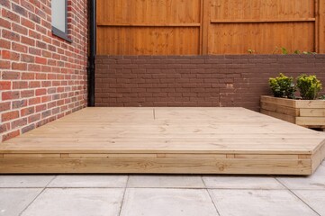 Newly built wooden deck in back garden. - obrazy, fototapety, plakaty