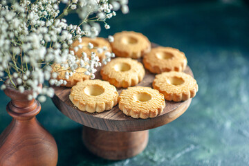front view sweet cookies on a dark background dessert biscuit sugar cake pie sweet break dough tea