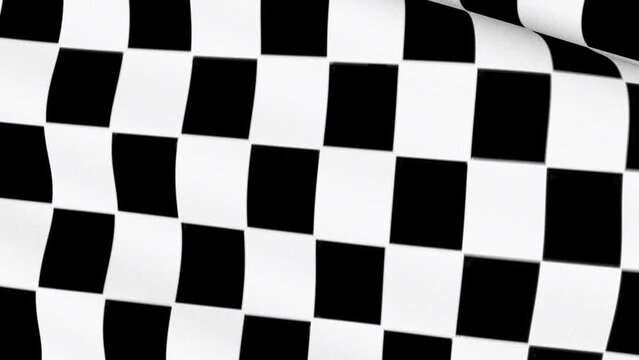 The checkered flag of Formula One. The checkerboard racing fabric is flying in the wind.