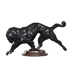 Crédence de cuisine en verre imprimé Monument historique Black sculpture of a tiger with it's head turned downward