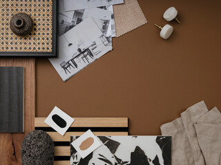 Modern flat lay composition in brown and beige color palette with textile and paint samples, lamella panels and tiles. Architect and interior designer moodboard. Top view. Copy space.