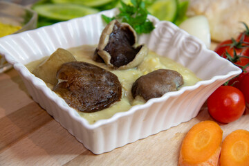 Soup with mushrooms and vegetables on the wooden table...boletus soup recipe...