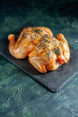 front view cooked spiced chicken on a dark background meat food barbecue dish meal color dinner pepper animal