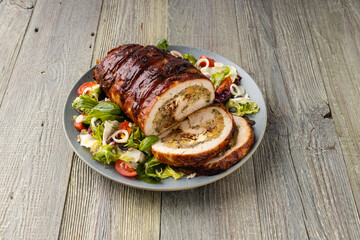 Stuffed turkey breast. Roasted whole, served with fresh vegetables.