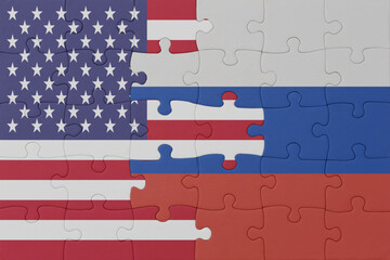 puzzle with the national flag of russia and united states of america. macro