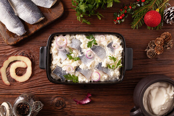 Herring fillet salad in cream with apple.