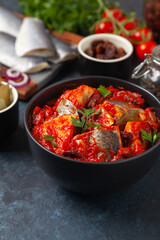 Herring fillet salad in tomato sauce.