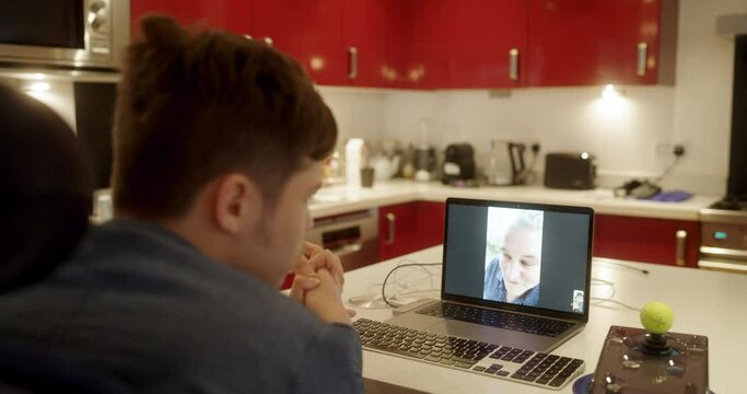 MS PAN Teenage boy with cerebral palsy on video call at home