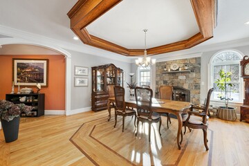 Formal dining room features a large wood table and chairs