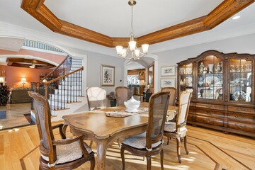 Dining room with an ornate wood ceiling and hardwood floors