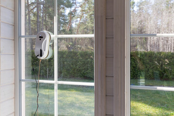 Window cleaning robot. Washing glass using technology in a modern home