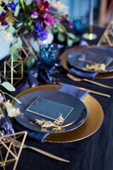 Beautiful table setting and flower composition