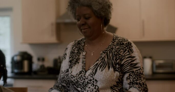 MS TS Mother and teenage son (16-17) in kitchen / Birmingham, UK