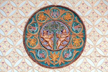 Circular glazed ethnic decoration on wall of Archangelo-Mikhailovsky Zverinetsky monastery in Kyiv, Ukraine