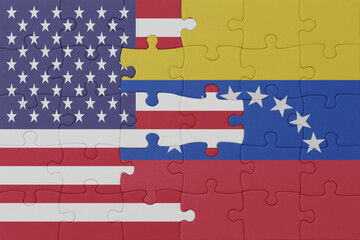 puzzle with the national flag of venezuela and united states of america. macro
