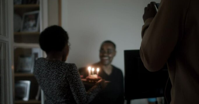 MS TS Children (10-11, 16-17) bringing father birthday cake / Birmingham, UK