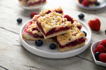 Homemade berry pastry squares on a white plate