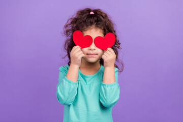 Photo of pretty funky small kid wear turquoise shirt red heart card close eye isolated purple color background