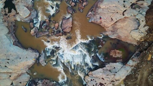 beautiful arial drone view of water spring passing through rocks in nature landscape HD
