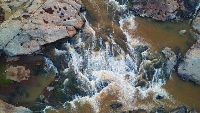 beautiful arial drone view of water spring passing through rocks in nature landscape HD