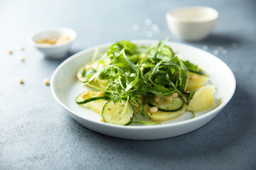Potato salad with cucumber and arugula