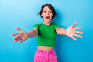 Photo of funny friendly girl wear green t-shirt surprised meeting congratulates her soulmates...