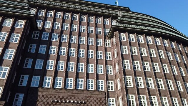 Pan along brick facade of Chilehaus in Hamburg city, 4k footage