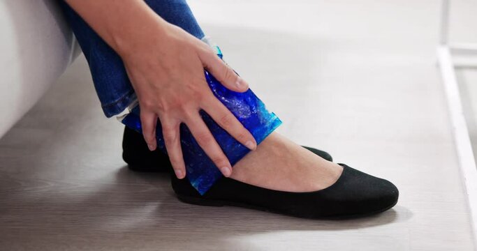 Woman Applying Ice Gel Pack