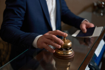 Man came to hotel and call in desk bell