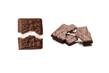 Dark chocolate candies isolated on white background.