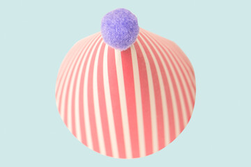 Bright and colorful birthday cap isolated on a green background.