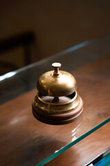 Bronze bell to call employees in customer reception area