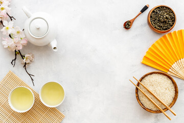 Fototapeta na wymiar Asian concept with tea set and rice bowl, top view