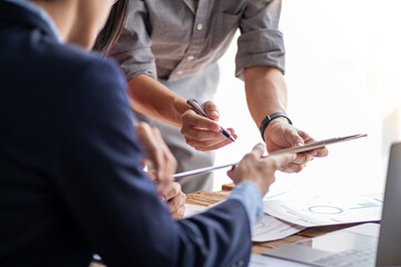 Closed up office conference room meeting diverse team of top manager, successful happy business team discussion share idea talking together, Young business group up meeting and pointing to the paper