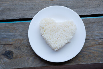 heart shaped steamed rice in a white plate.