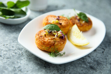 Traditional homemade fish cakes with lemon