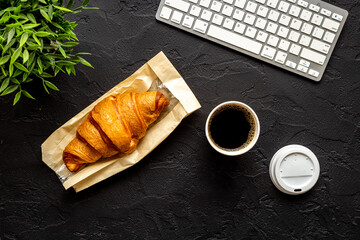 Coffee break in the office. Paper cup of coffee with keyboard, top view