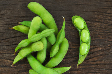 Japanese boiled green soybeans edamame healthy snacks on a wooden background