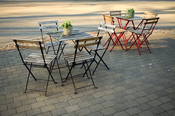 Fototapeta na wymiar Black and red outdoor cafe furniture.