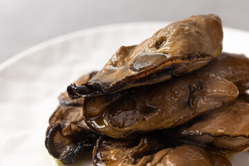 Smoked oysters smoked and marinated in olive oil