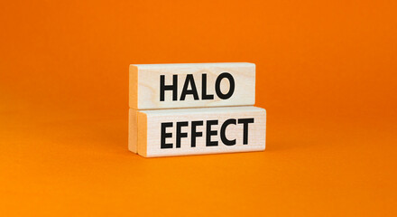Halo effect and psychological symbol. Concept words Halo effect on beautiful wooden block. Beautiful orange table orange background. Business psychological and Halo effect concept. Copy space.