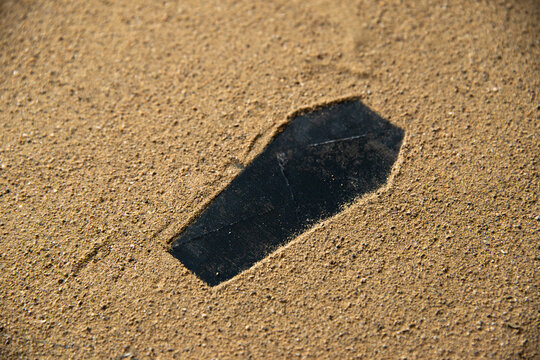 black coffin shape made on the sand death funeral israel war warriors