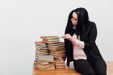 woman with pointer teacher in books in library teaching science education