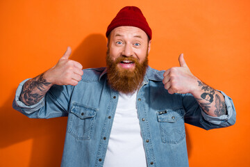 Photo of young person guy showing thumb up fine symbol advertise sale offer isolated on vibrant...