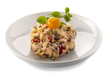 Rice salad with vegetables and tomatoes and peas and chicken meat with yellow cherry tomato and sprig of marjoram in white plate