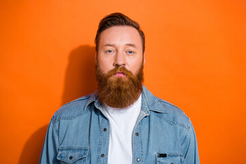 Portrait of serious millennial young guy with groomed beard barber shop advertising isolated bright color background