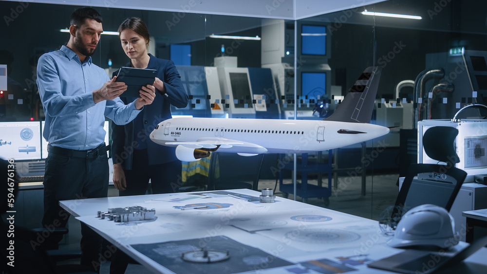 Poster aeronautics factory office meeting room: engineer holds tablet computer, showing augmented reality a