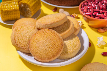 Traditional Festa Junina Summer Festival Carnival Food. Traditional Brazilian Festa Junina dishes and snacks - popcorn, peanuts, corn cake and cookie, pacoca, with holiday decorations and accessories